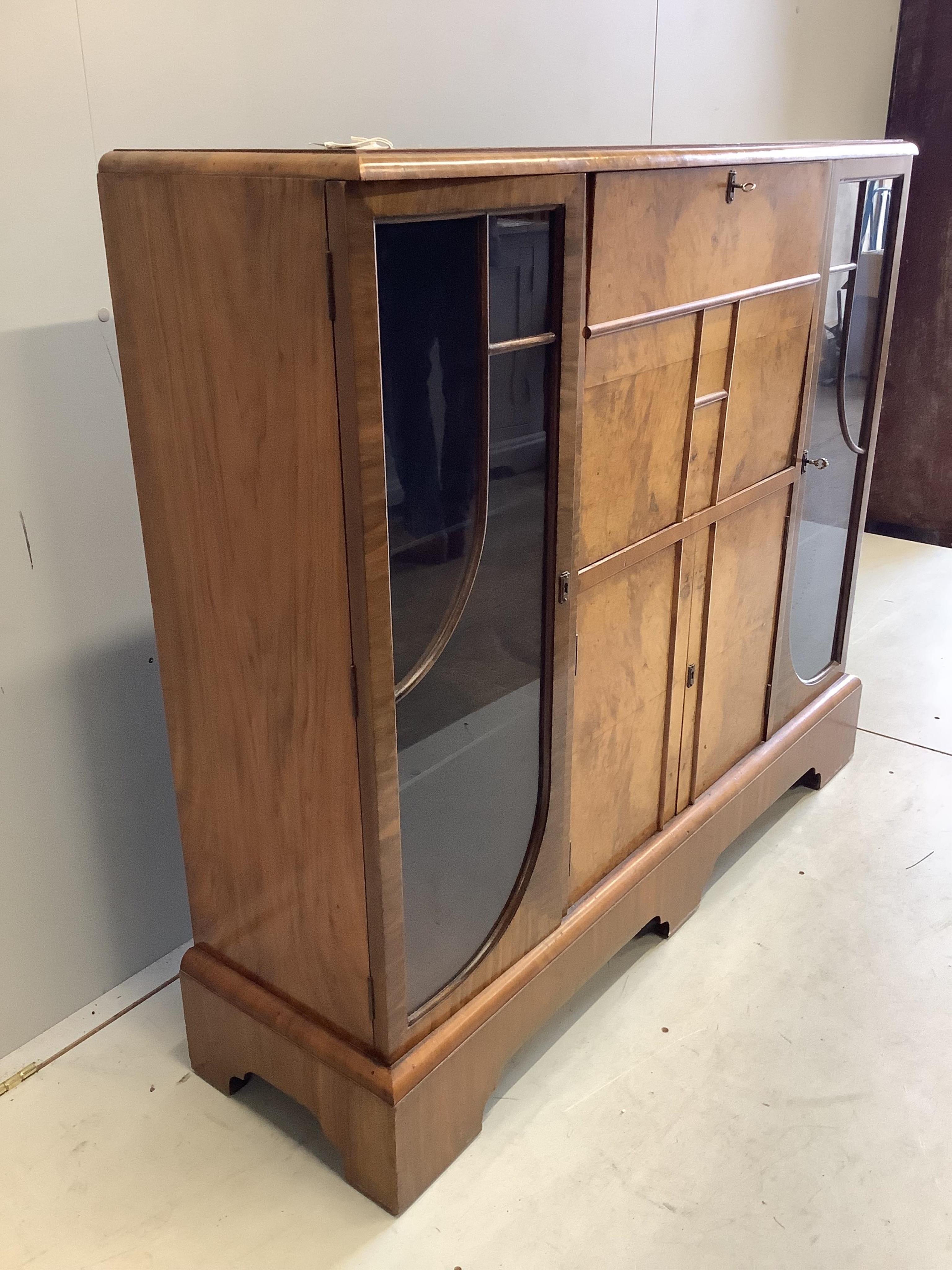 An early 20th century Art Deco style burr walnut secretaire cabinet, width 122cm, depth 34cm, height 107cm. Condition - fair to good.